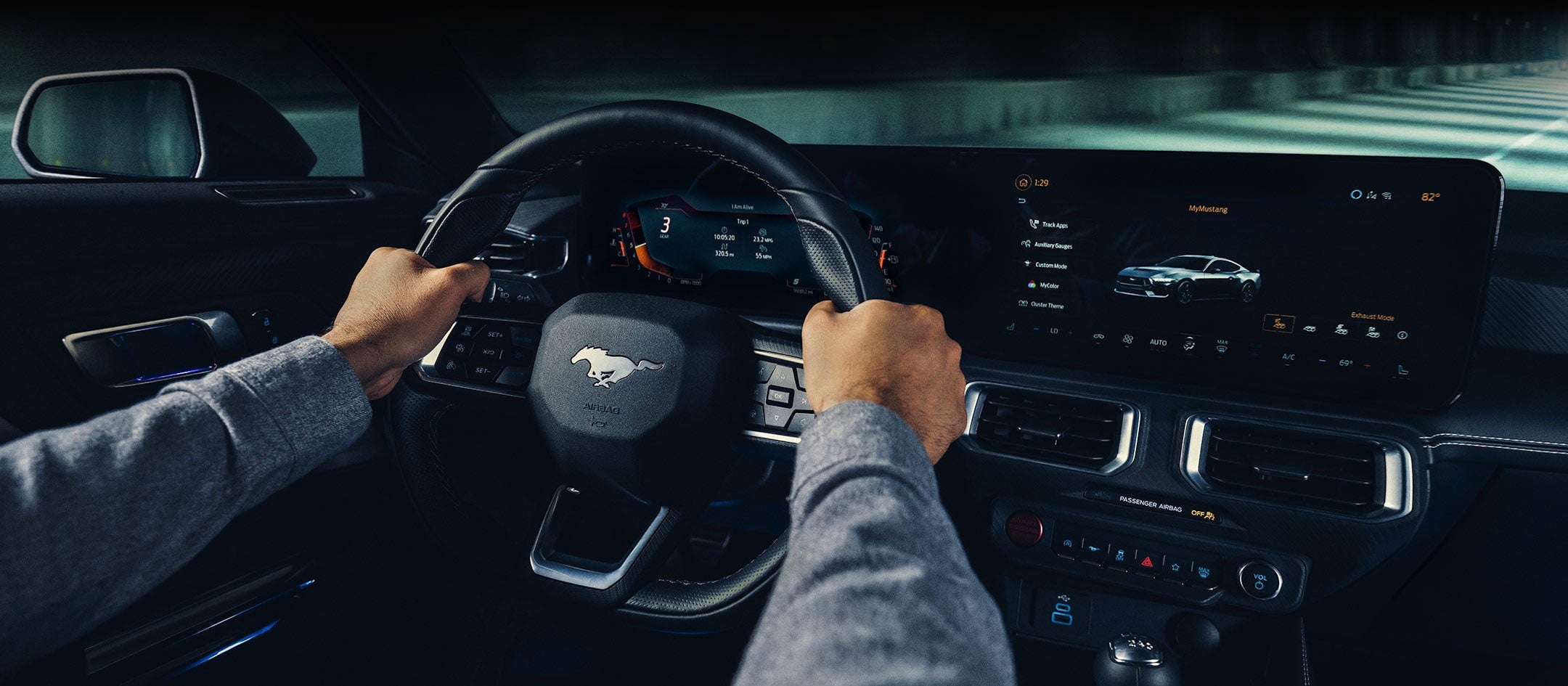 A 2024 Ford Mustang® model interior with a person driving | Benton Ford in Benton KY